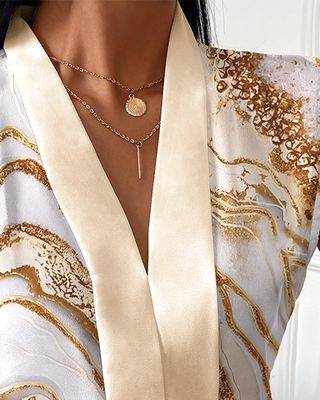 Moda V boyun kolsuz üst sıradan baskılı V boyun tişörtü